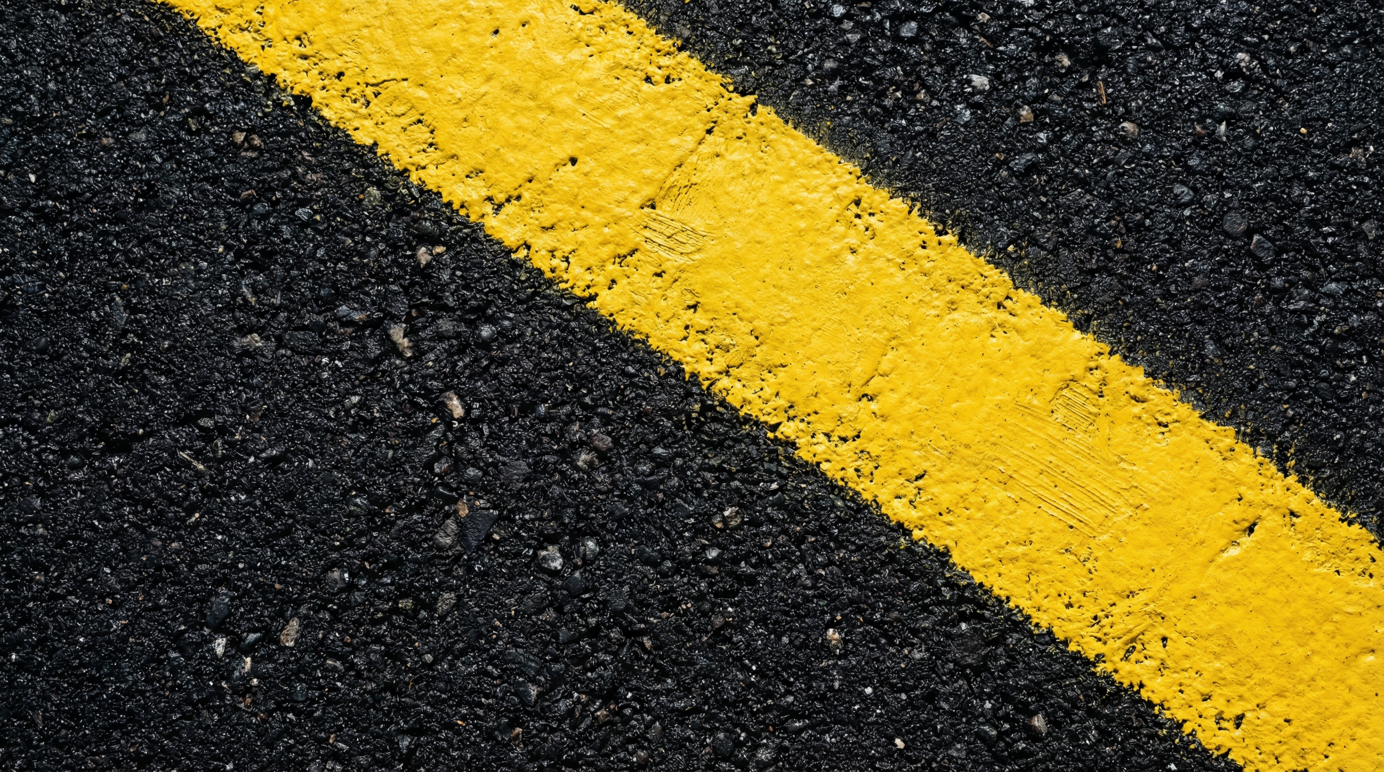 Asphalt with yellow road stripe