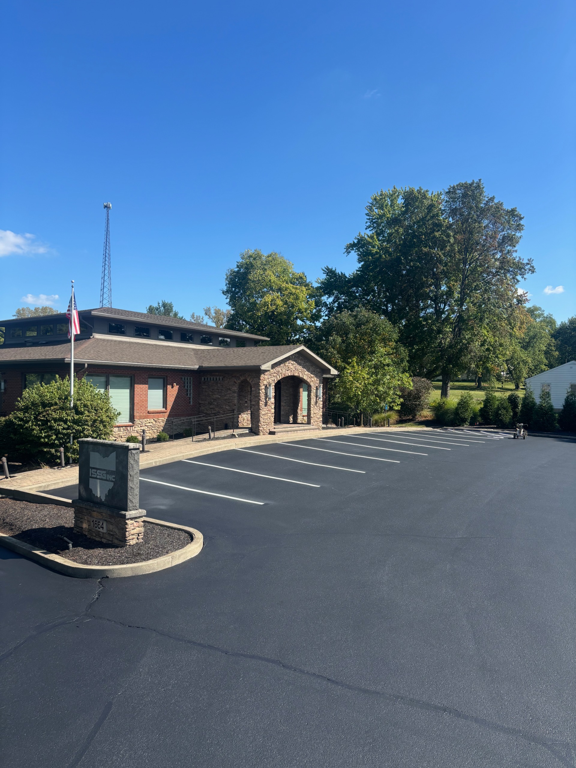 Commercial parking lot with visible wear and crack damage